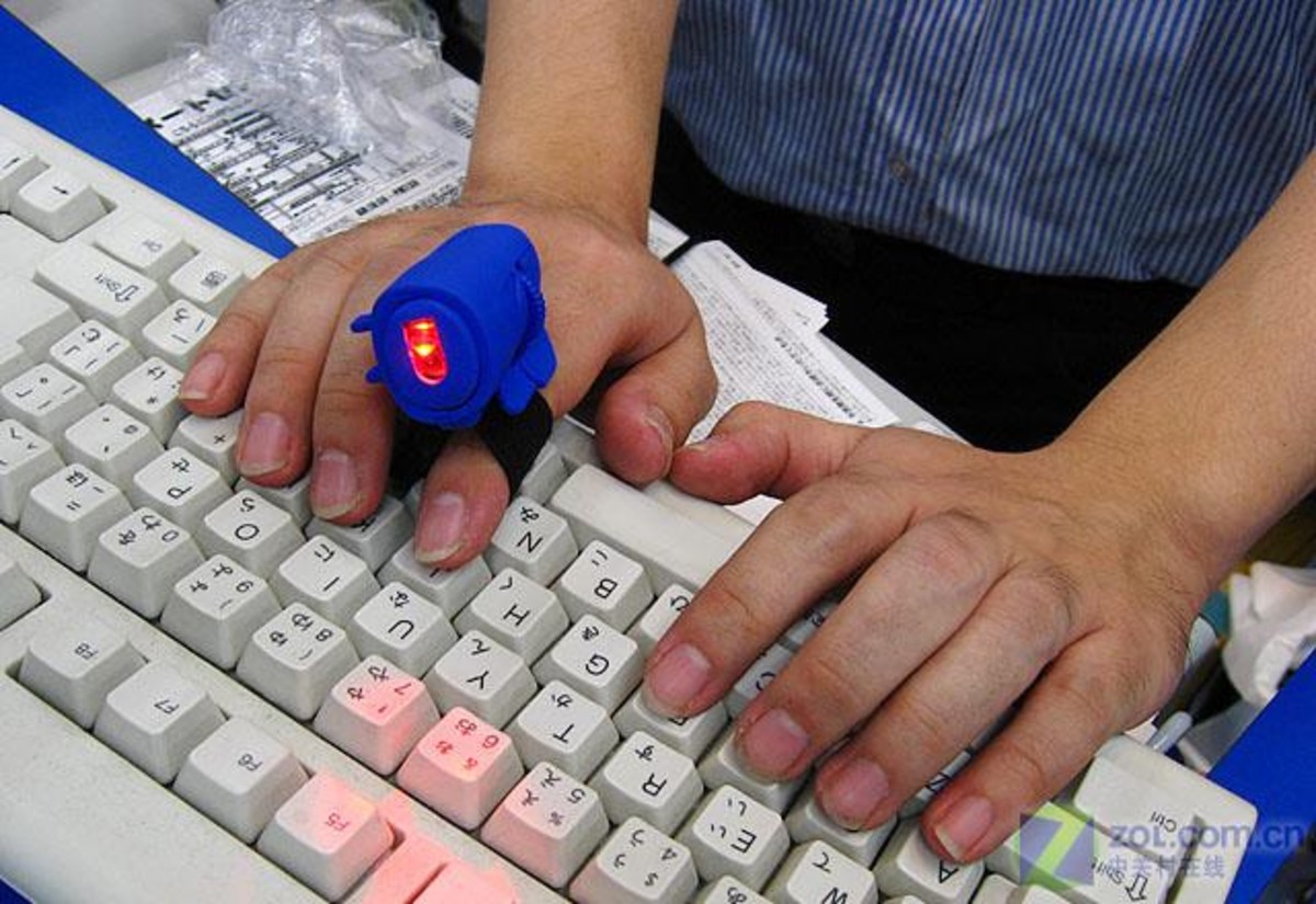 【高清图】激光引擎 套在手指上使用的鼠标上市图2-zol中关村在线